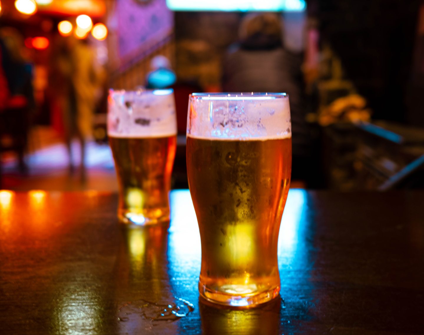 Two Beer Glasses in a Pub