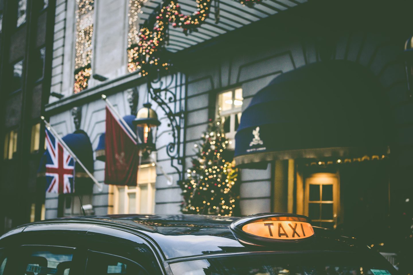 A London taxi outside of a hotel