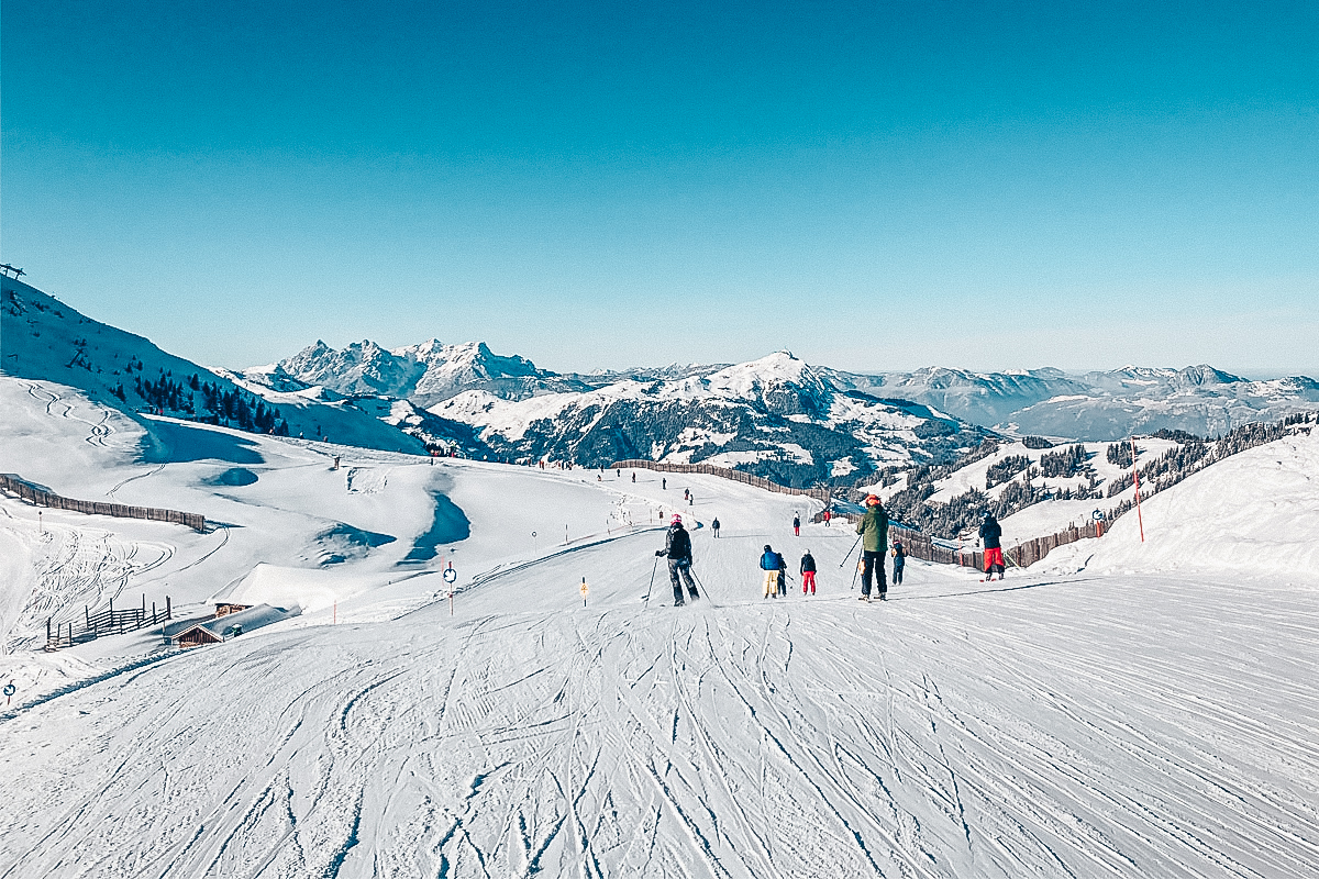 Skiers in Kitzbühel, Austria - one of the best european ski resorts for beginners
