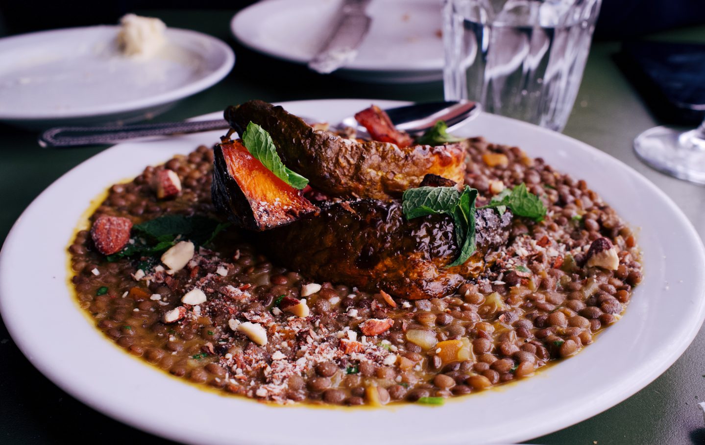 Delica pumpkin with lentils, almonds and pumpkin butter, served with fresh mint and chopped nuts at Forza Wine. The generous sharing plate highlights the food alongside the wine at this London wine bar.